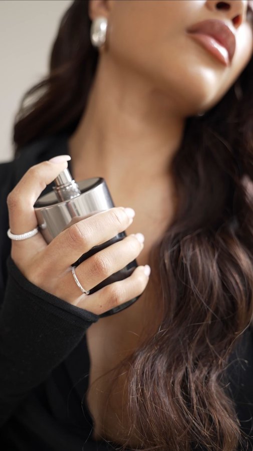 Instagram post by @lozvassallo for Molton Brown. Caption reads: ad. Spritzing on a burst of new spring energy!✨....