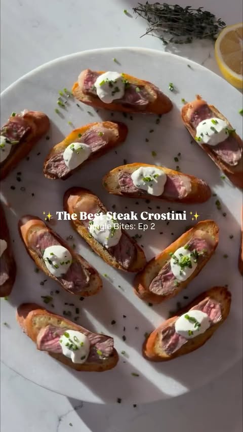 Instagram post by @rachaellsrecipes for 4th & Heart. Caption reads: 🥩 Steak Crostini 🥩 This stunning appetizer is....