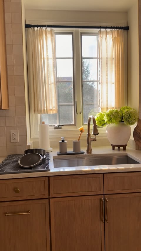 Instagram post by @homebyxi for Dorai Home. Caption reads: Giving my kitchen sink a refresh for the spring!....