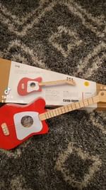 Instagram post by @erinrose222 for Loog Guitars. Caption reads: [...] Christmas gift for your toddler?....