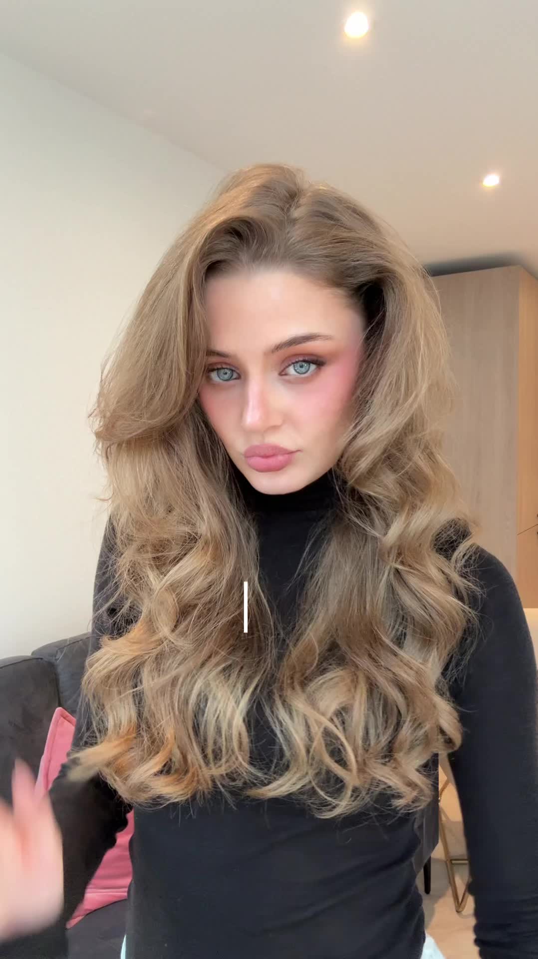 TikTok post by @ellamaerennison_ for BaByliss. Caption reads: [...] effortless long lasting curls using....