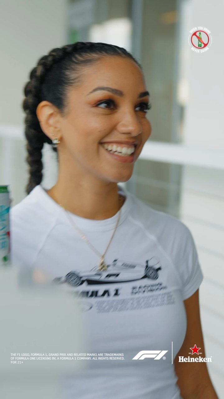 Instagram post by @corinnefoxx for Heineken US. Caption reads: Pardon my language but no one does F1 quite like....