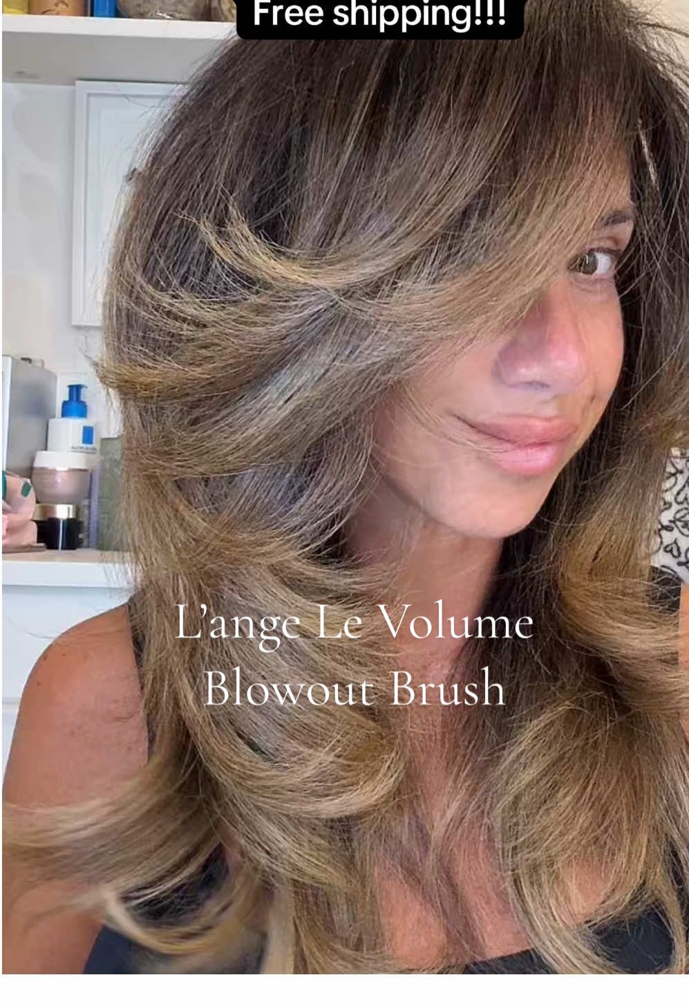 TikTok post by @daniella_britt for L'ange Hair. Caption reads: Frizz-free, salon-quality blowouts without the....