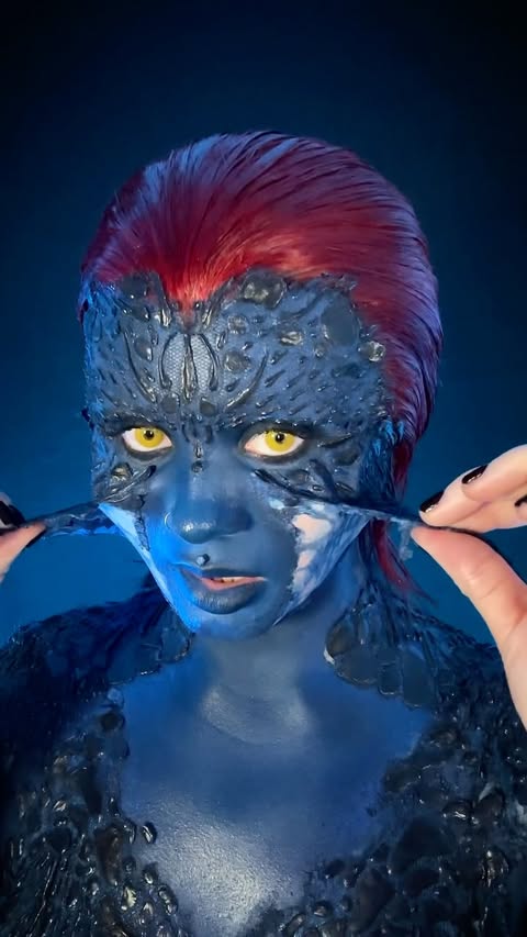 Instagram post by @vocallyshook for Mehron Makeup. Caption reads: [...] neon orange pigment) __ ✖️Makeup:....