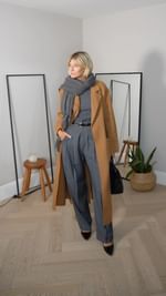 Instagram post by @fashionandstyleedit for DVF. Caption reads: 8 ways to wear a camel coat this Autumn Winter 🍂....