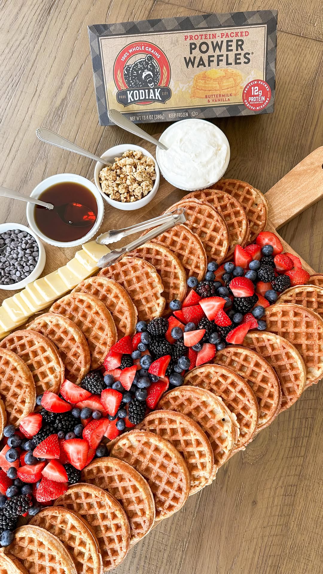 Instagram post by @samanthabauchmann for Kodiak Cakes. Caption reads: BUILD YOUR OWN WAFFLE BAR with @kodiakcakes //....