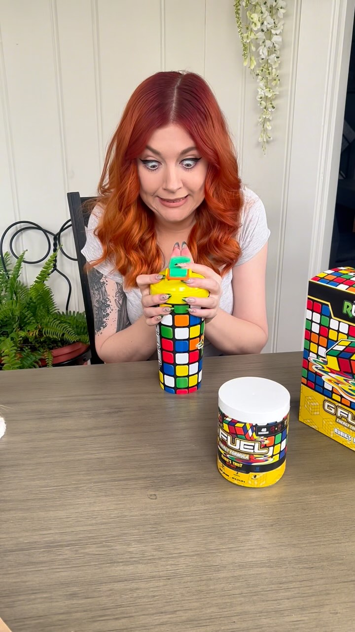 Instagram post by @cahlaflour for G FUEL. Caption reads: My cat tried to steal my new @gfuelenergy Rubik’s....