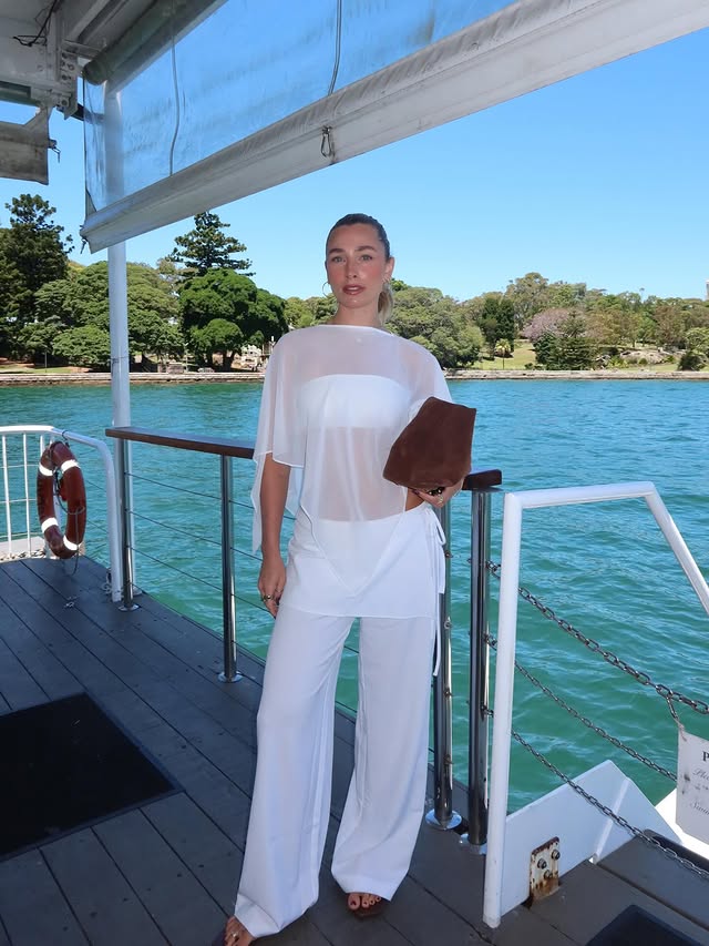 Instagram post by @cattcity for Glassons. Caption reads: Bold of me to wear all white considering I’m a....