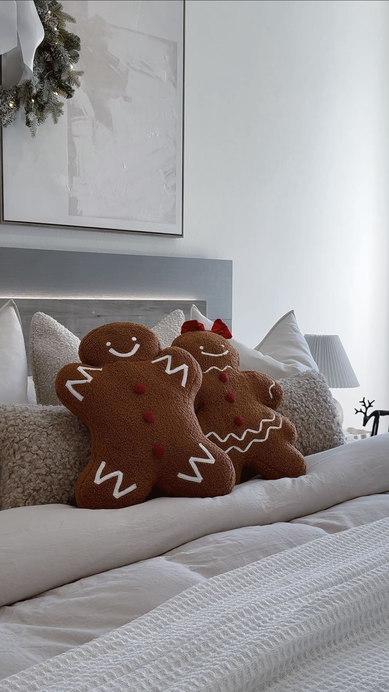 Instagram post by @lauri_b for Rooms To Go. Caption reads: The cutest holiday pillows ever🧸♥️🎅🏼|💬Comment....