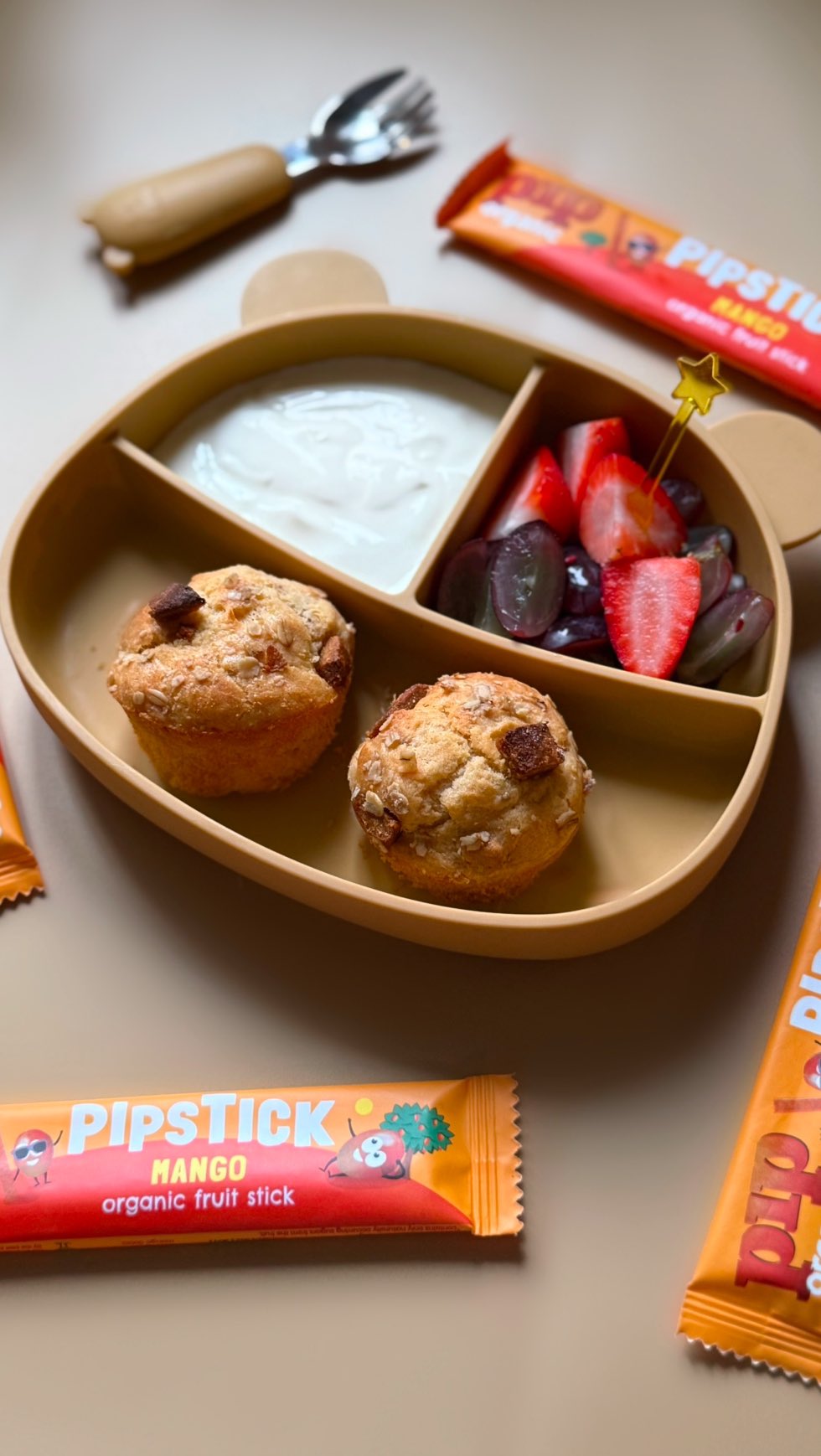 Instagram post by @tinytumsrecipes for Pip Organic. Caption reads: Dried mango muffins 🥭 
School is back soon and....