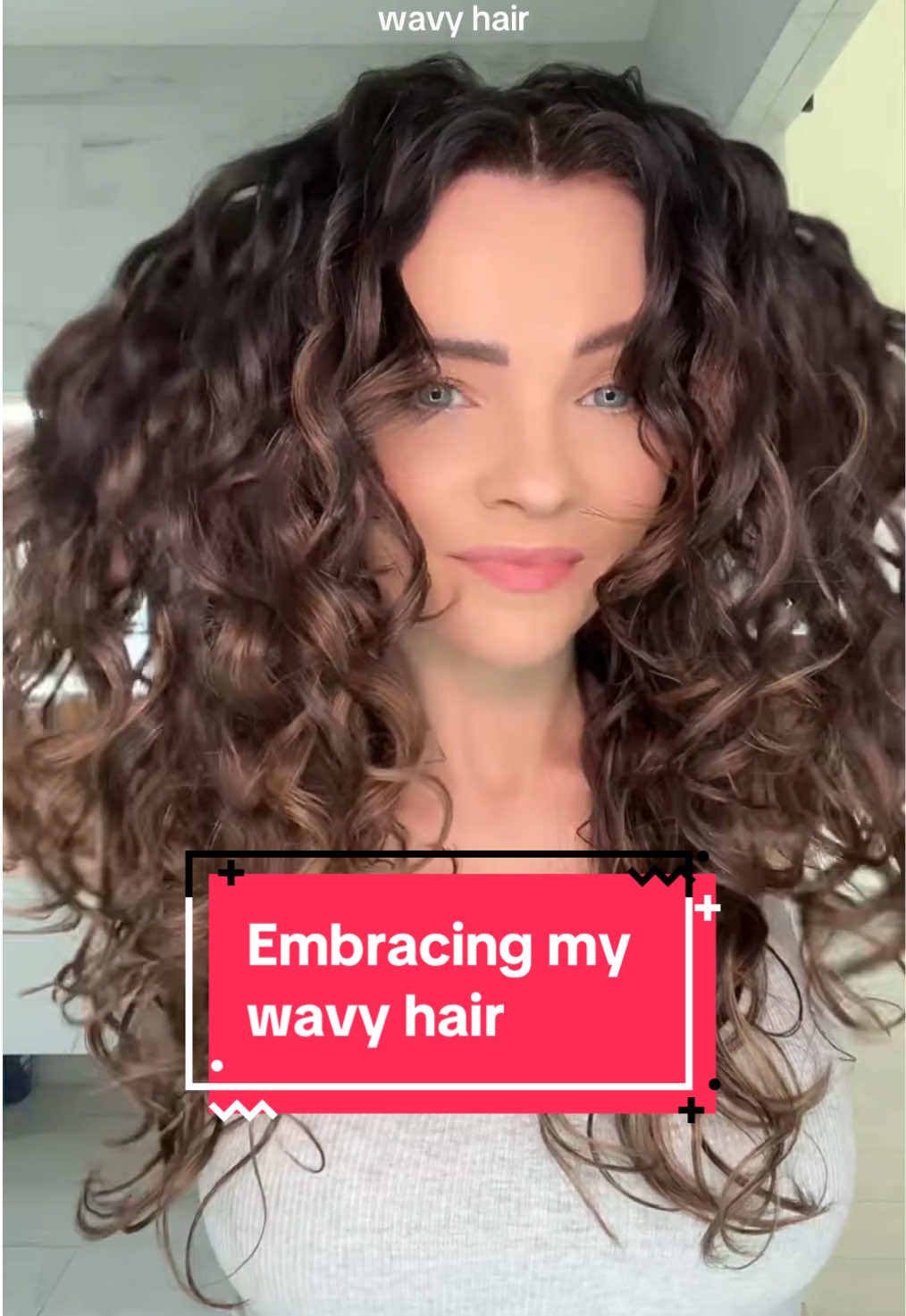 TikTok post by @wavycurly for BounceCurl. Caption reads: [...] | Hair Plop ➰ Brush: @BounceCurl Define....