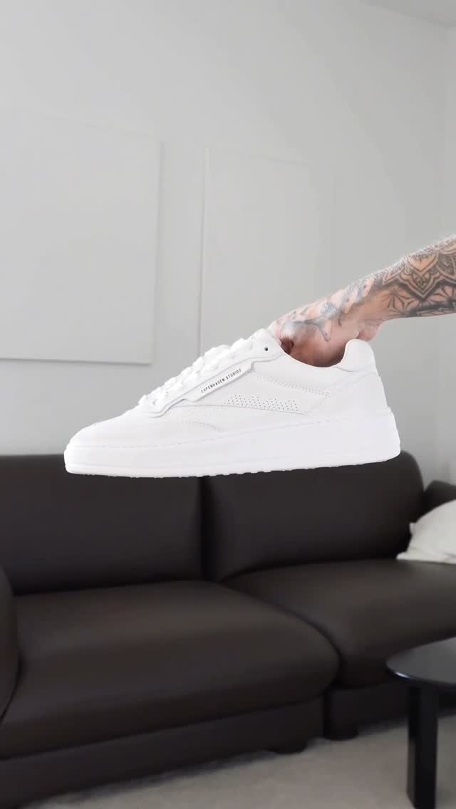 Instagram post by @kiimandersen for COPENHAGEN STUDIOS. Caption reads: Ad* styling white sneakers from....