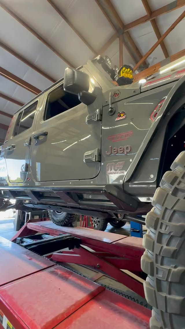 Instagram post by @spartacus_the_jt for EZ FLATE. Caption reads: [...] @4x4spod @bajadesigns @rpm_steering @ezflate....