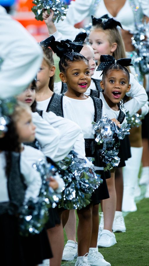 Instagram post by @raiderettes for Intermountain Health. Caption reads: #ad Give it up for the Jr. Raiderettes on their....