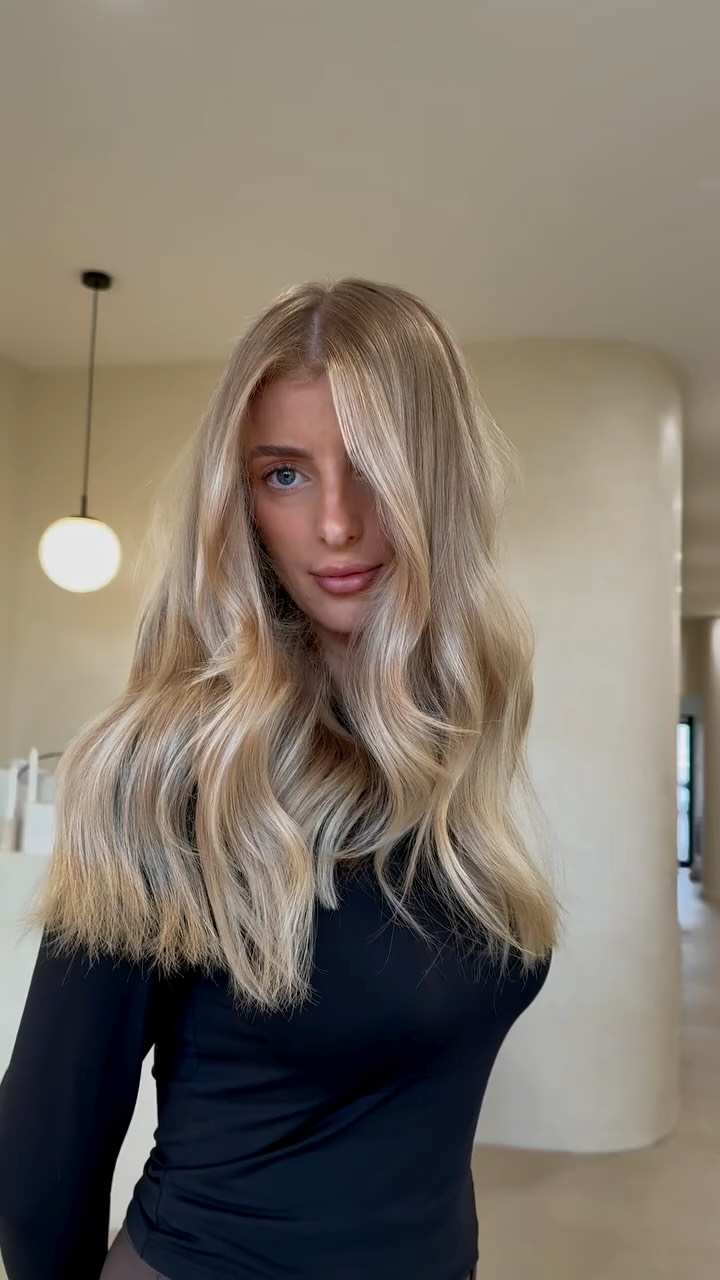 Instagram post by @jennailiouhair for American Salon. Caption reads: Blonde so good it speaks for itself ✨ The bar’s....