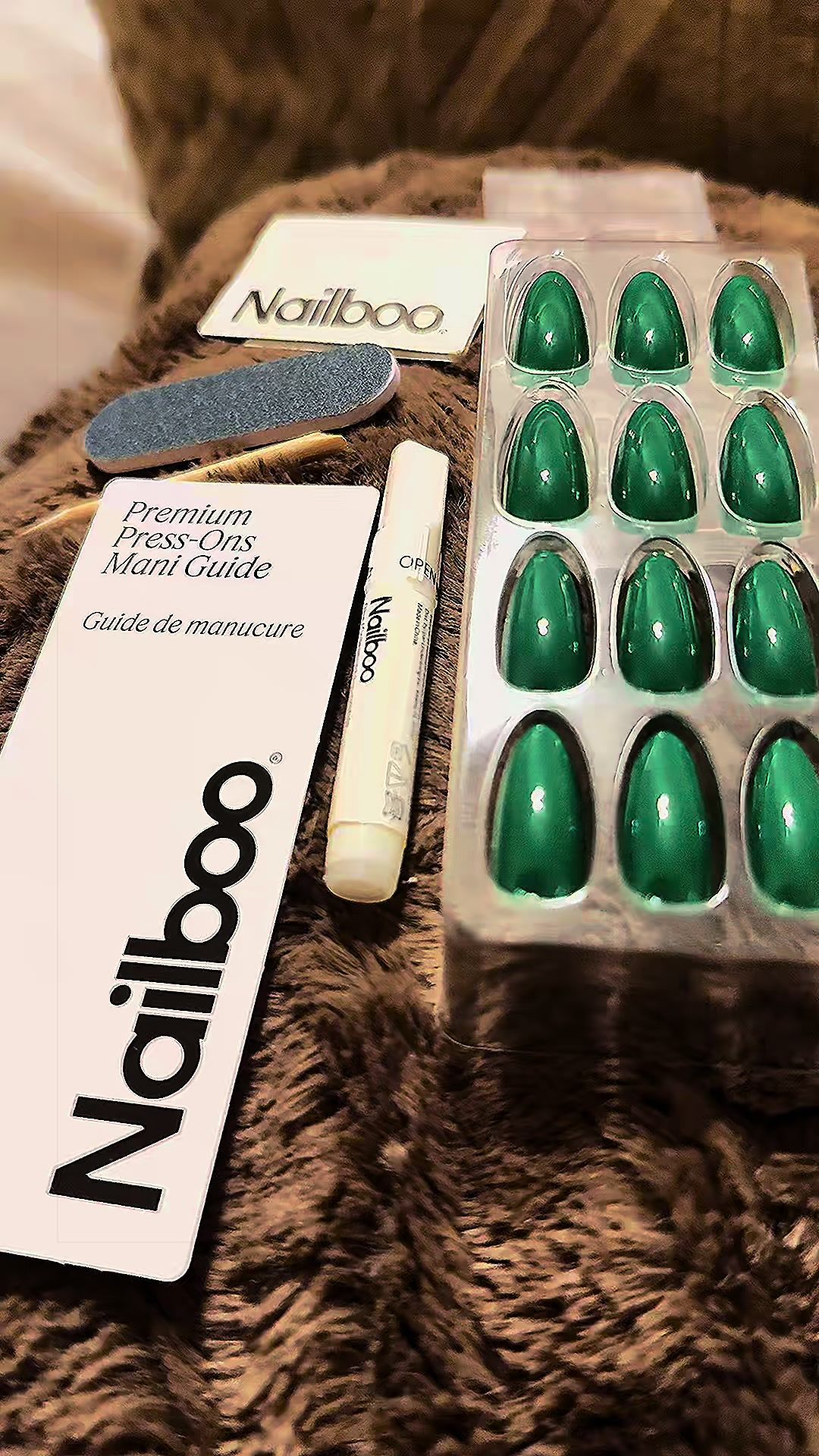 TikTok post by @exoticqueen for Nailboo. Caption reads: [...] in minutes without the salon price. ✨Nailboo....