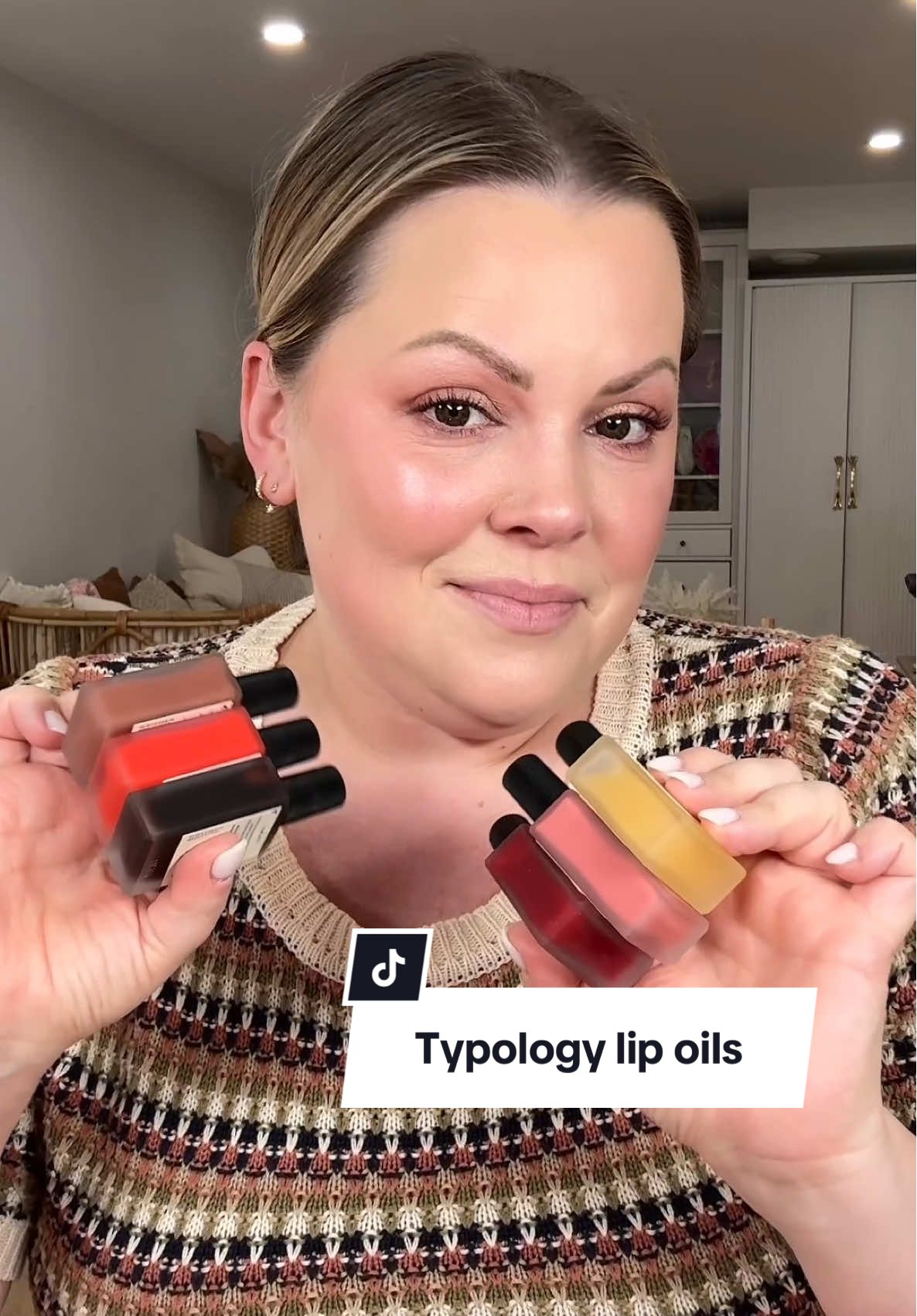 TikTok post by @selenamup for Typology. Caption reads: The @Typology Paris lip oils give you a sheer soft....