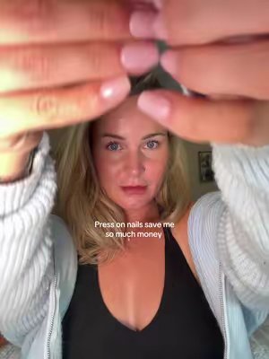 TikTok post by @emmatwinmum for Ellie Young Beauty Shop. Caption reads: Saving myself so much money using press on nails.....