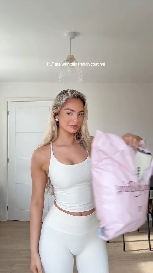 Instagram post by @ruthyoungx for PrettyLittleThing. Caption reads: wow @prettylittlething 

#trenchcoat....