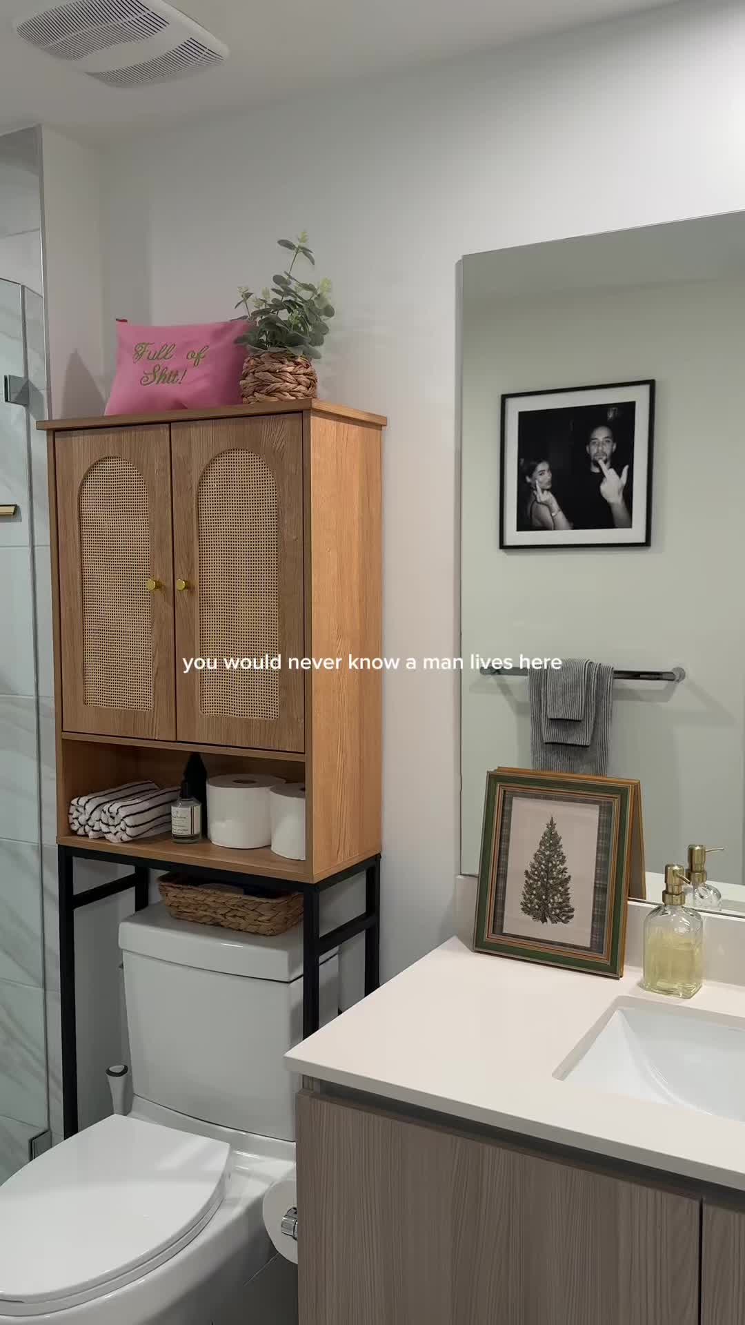 TikTok post by @fyimaylin for Vabches. Caption reads: [...] storage cabinet completes my bathroom ✨....