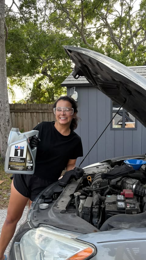 Instagram post by @gabbydolechek for SheSpeaks. Caption reads: #Ad Learning how to change my own oil at home....