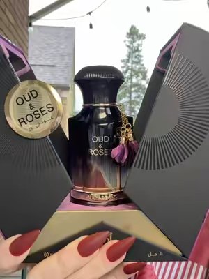 TikTok post by @thismamasonamission for PerfumeboxUSA. Caption reads: [...] is ouding. The rose is rose-ing.....