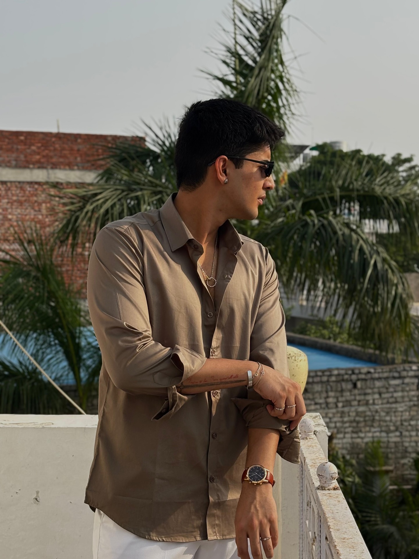 Instagram post by @kaushik____devansh for Daniel Wellington. Caption reads: A statement starts at the wrist.⌚✨

The Iconic....