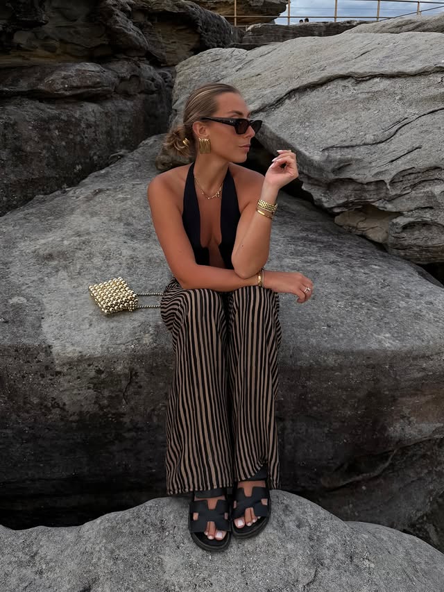 Instagram post by @dianeperreau for Ray-Ban. Caption reads: one @rayban per day keeps the rain away 🖤 [...].