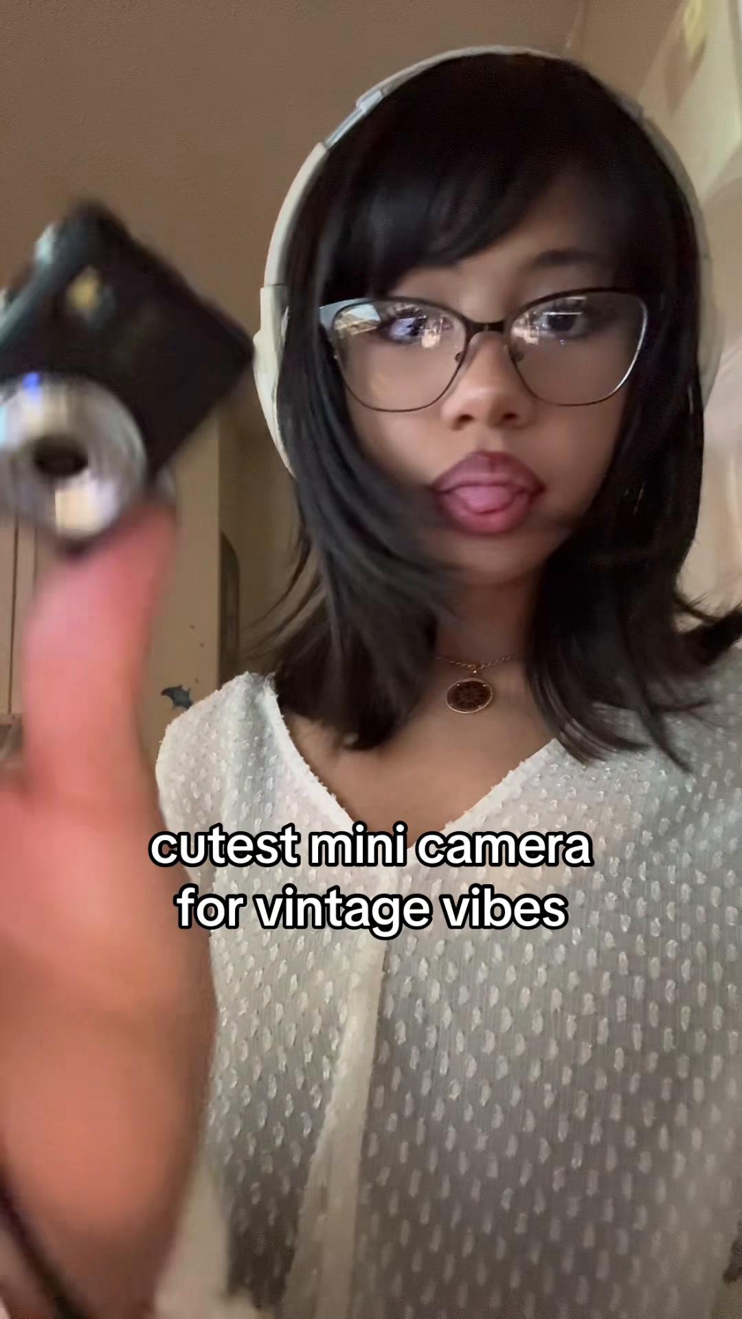 TikTok post by @twqylilive for Fitpolo. Caption reads: i love my cute little camera def using this on my....