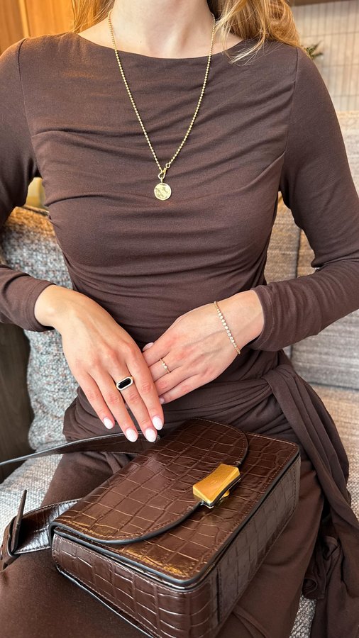 Instagram post by @whatlanaloves for Edge of Ember. Caption reads: [...] the sophisticated moment with @edgeofember....