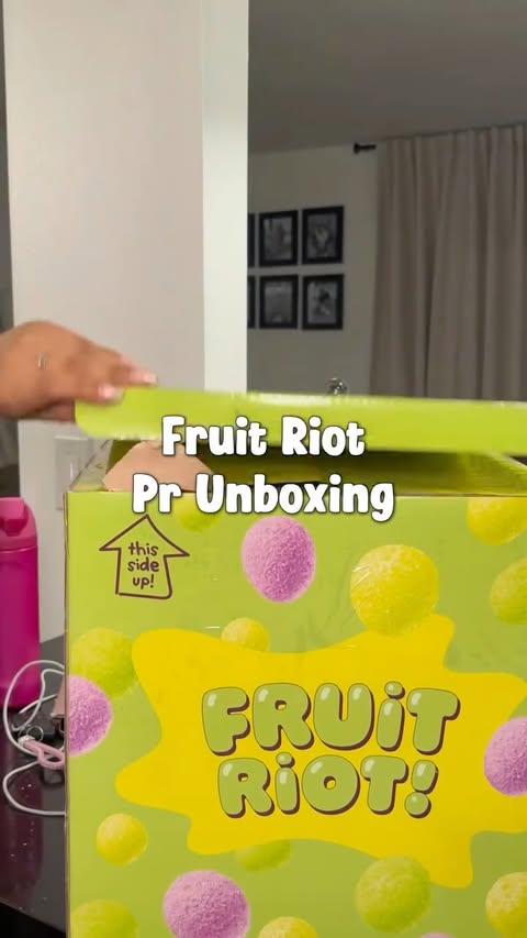 Instagram post by @perlaasantanaa for Fruit Riot. Caption reads: Fruit Riot Pr Unboxing 📦🍬🩷✨ Look what I just....