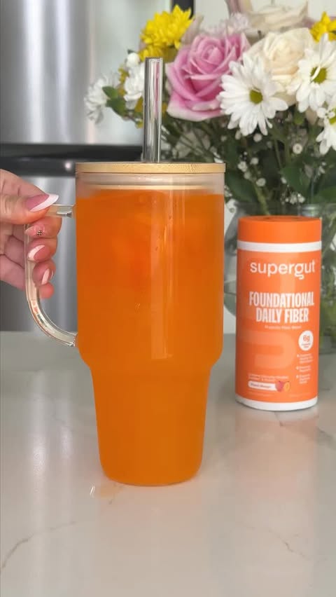 Instagram post by @lyndasedoud for Supergut. Caption reads: XXL Mango Peach Drink 🥭🍑 @supergut #asmr #drinks....