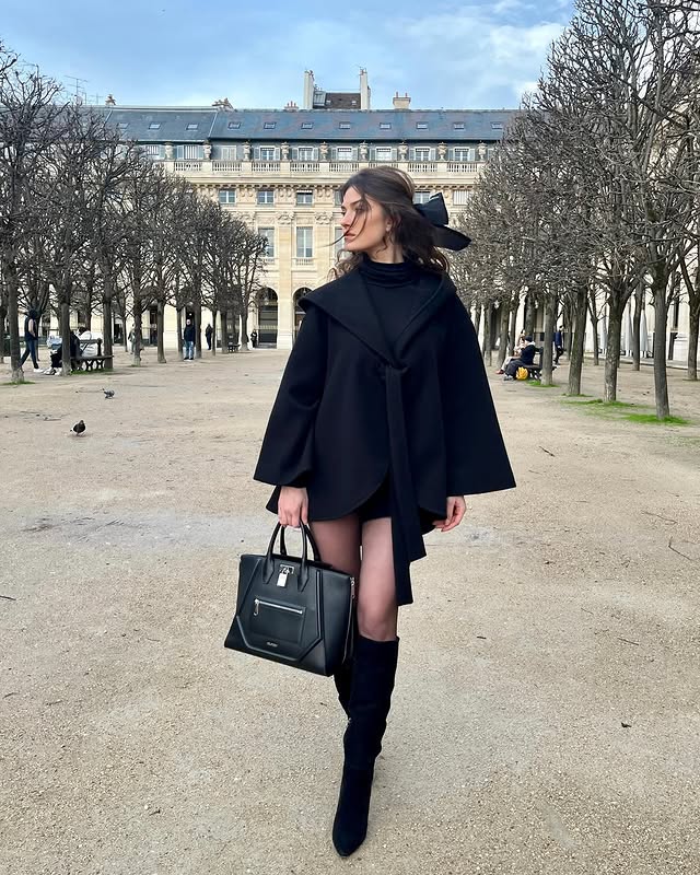 Instagram post by @evedumon for Kuoser. Caption reads: Felt cute 🖤 in @kuose_official_ 
Team hood on or....