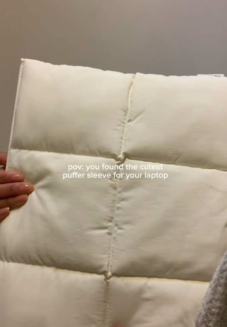 TikTok post by @lovewithkarina for Comfyable. Caption reads: [...] but practical puffy laptop sleeve from....