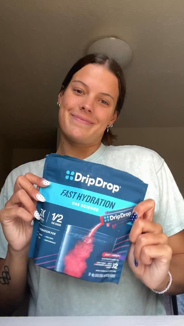 Instagram post by @anna_peplowski for DripDrop. Caption reads: Hours in the pool mean hydration is key —....