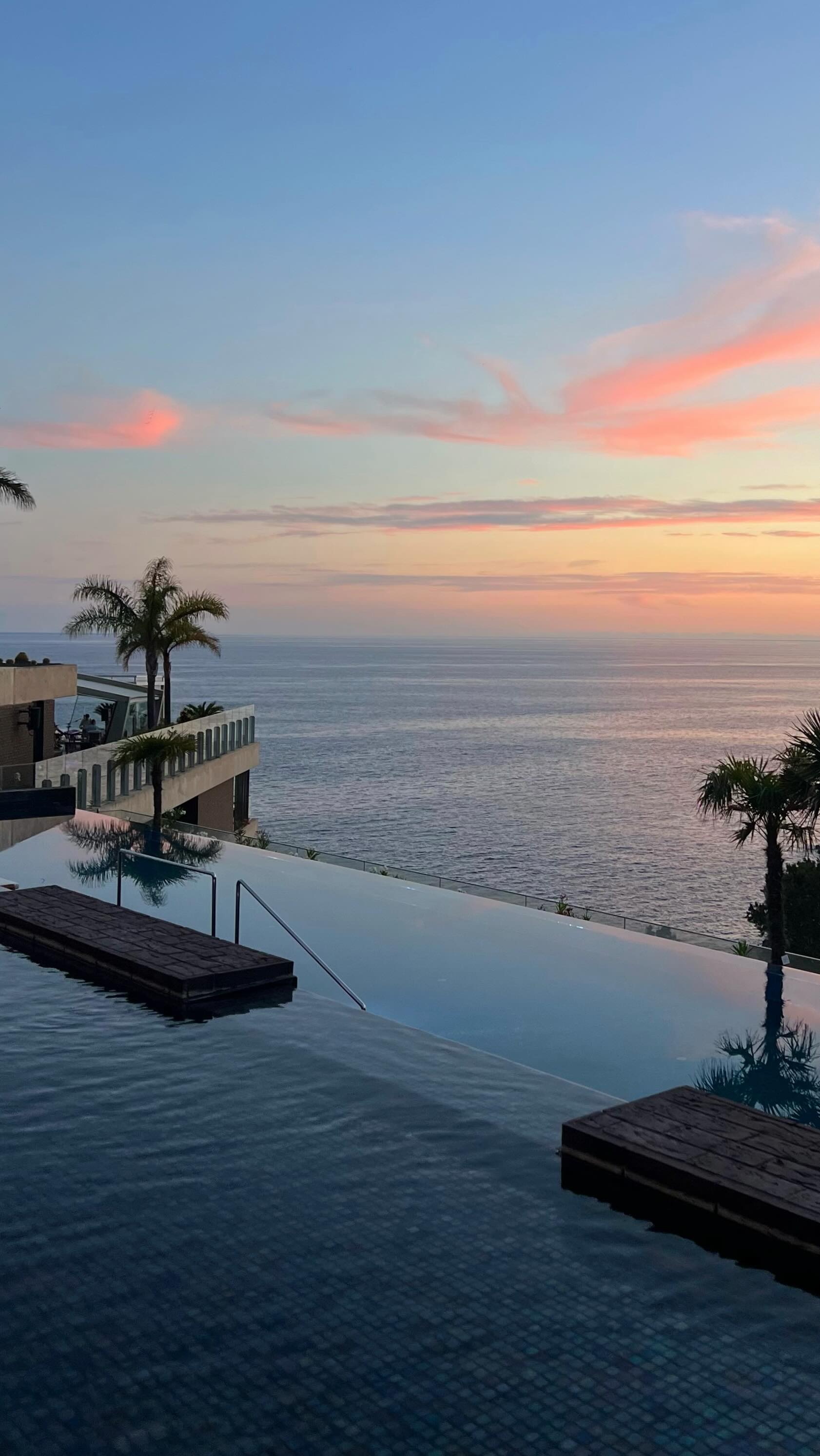 Instagram post by @davidescri for The Gay Passport. Caption reads: Looking back at days spent between the ocean and....