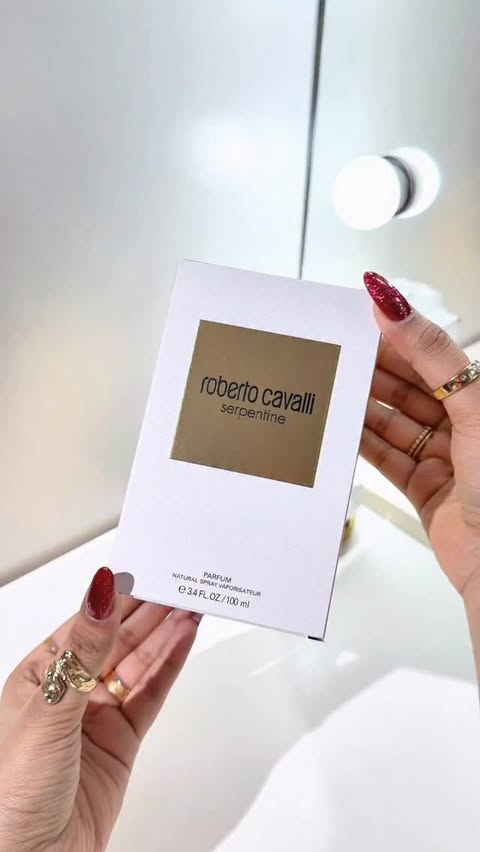 Instagram post by @iqrashahbaz110 for Roberto Cavalli. Caption reads: [...] at @theperfumeshop #perfume #robertocavalli....