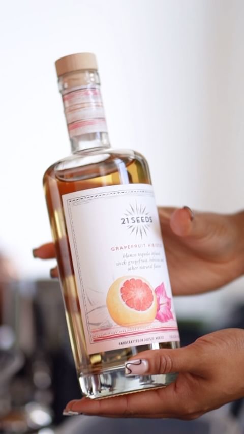 Instagram post by @bellamerlot_ for 21Seeds Infused Tequila. Caption reads: #Ad I hosted my first cocktail class in Charlotte,....