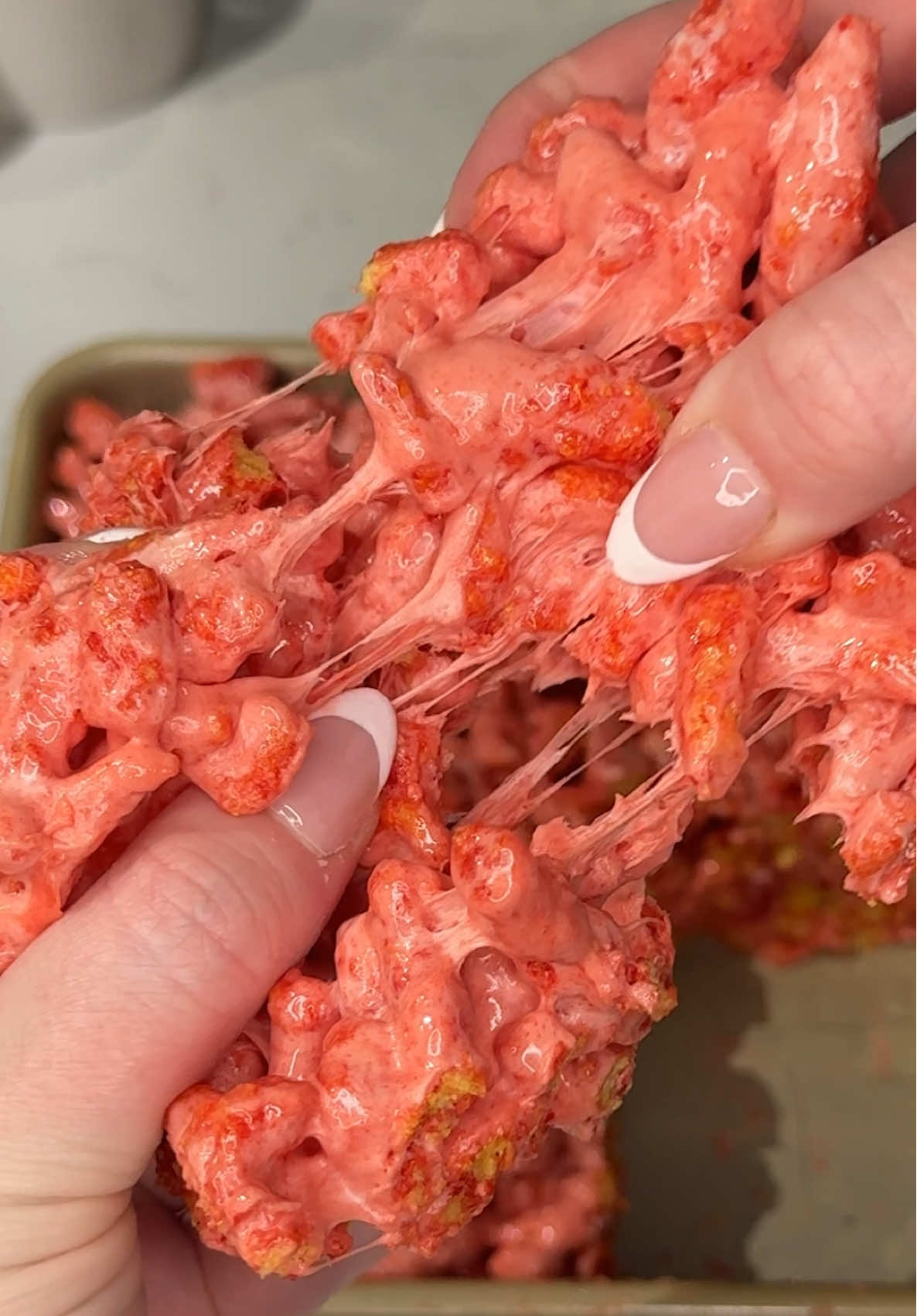 TikTok post by @ashleymarkleeats for Cheetos. Caption reads: this is your sign to try marshmallow hot cheetos....