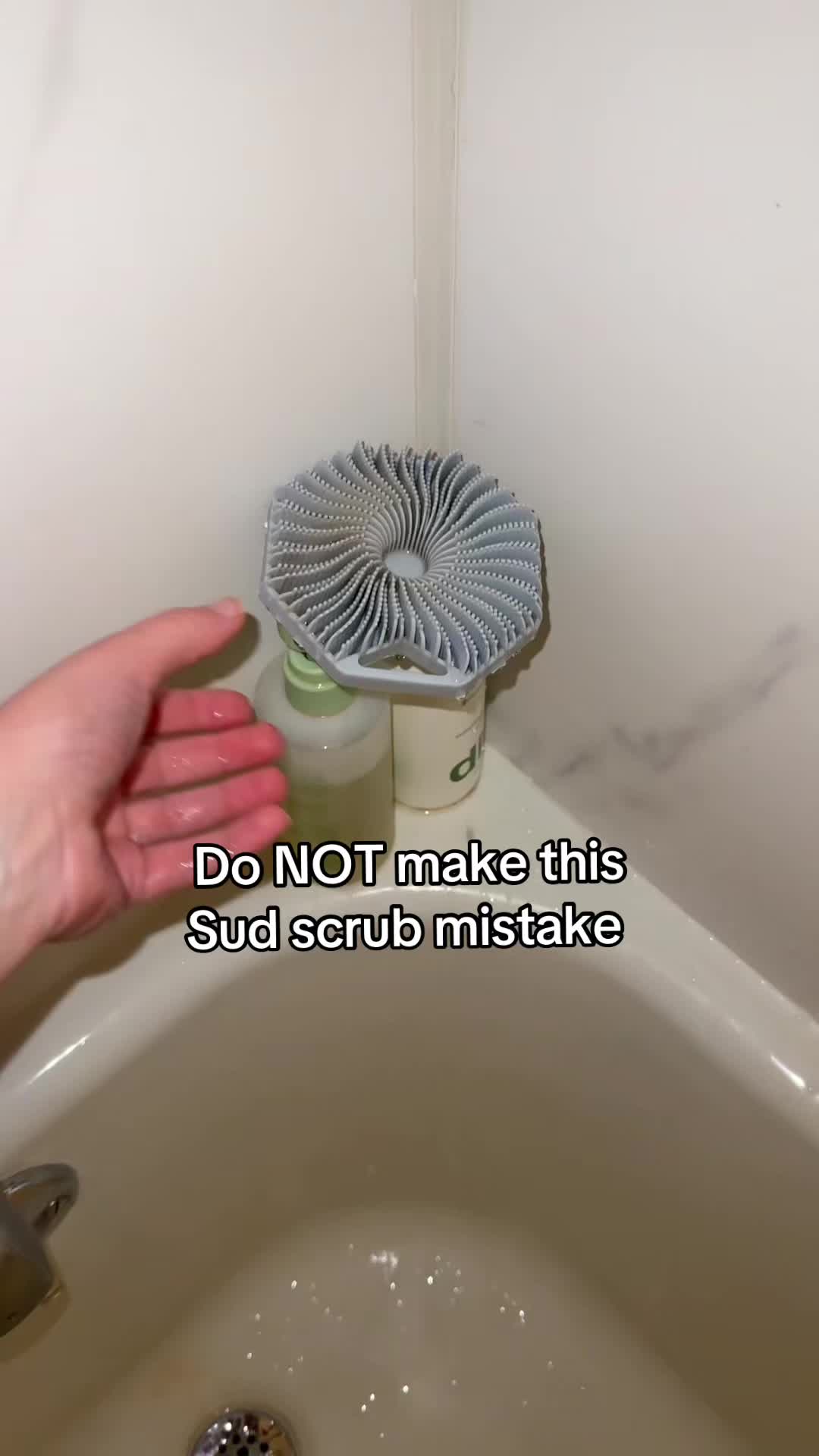 TikTok post by @angey809 for Sud Scrub. Caption reads: Hang your sud scrubber on a hook to help it dry!....