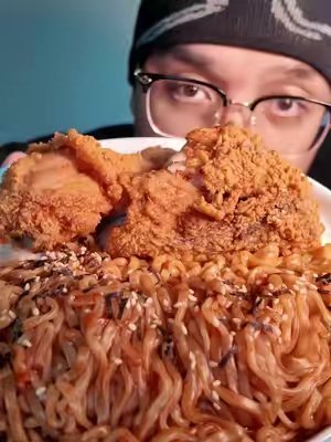 TikTok post by @whereswarhol for Momofuku. Caption reads: [...] and chilli oil @Jollibee @Buldak @Momofuku....