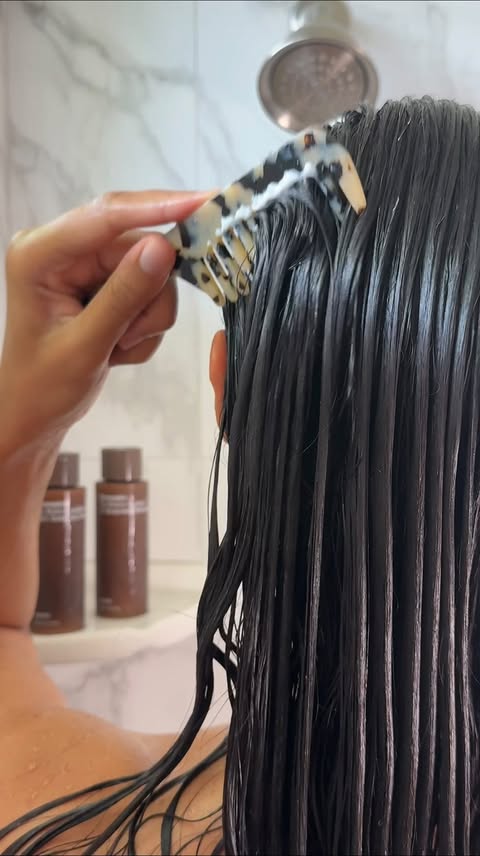 Instagram post by @alohabelles for Nécessaire. Caption reads: You know those days when your curls just feel full....