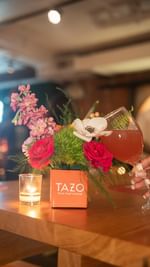 Instagram post by @ashlee.jmarie for Tazo. Caption reads: Hey Friends 🫶🏾 Join me next Tuesday, August....