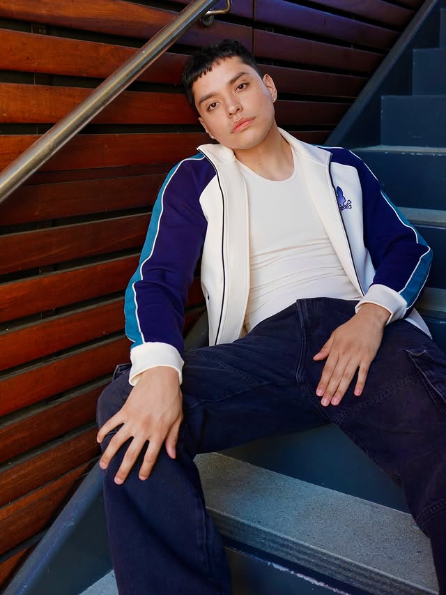 Instagram post by @ethan_campuzano for Psycho Bunny. Caption reads: [...] 📸: @anname_1995 Track Bomber Jacket:....