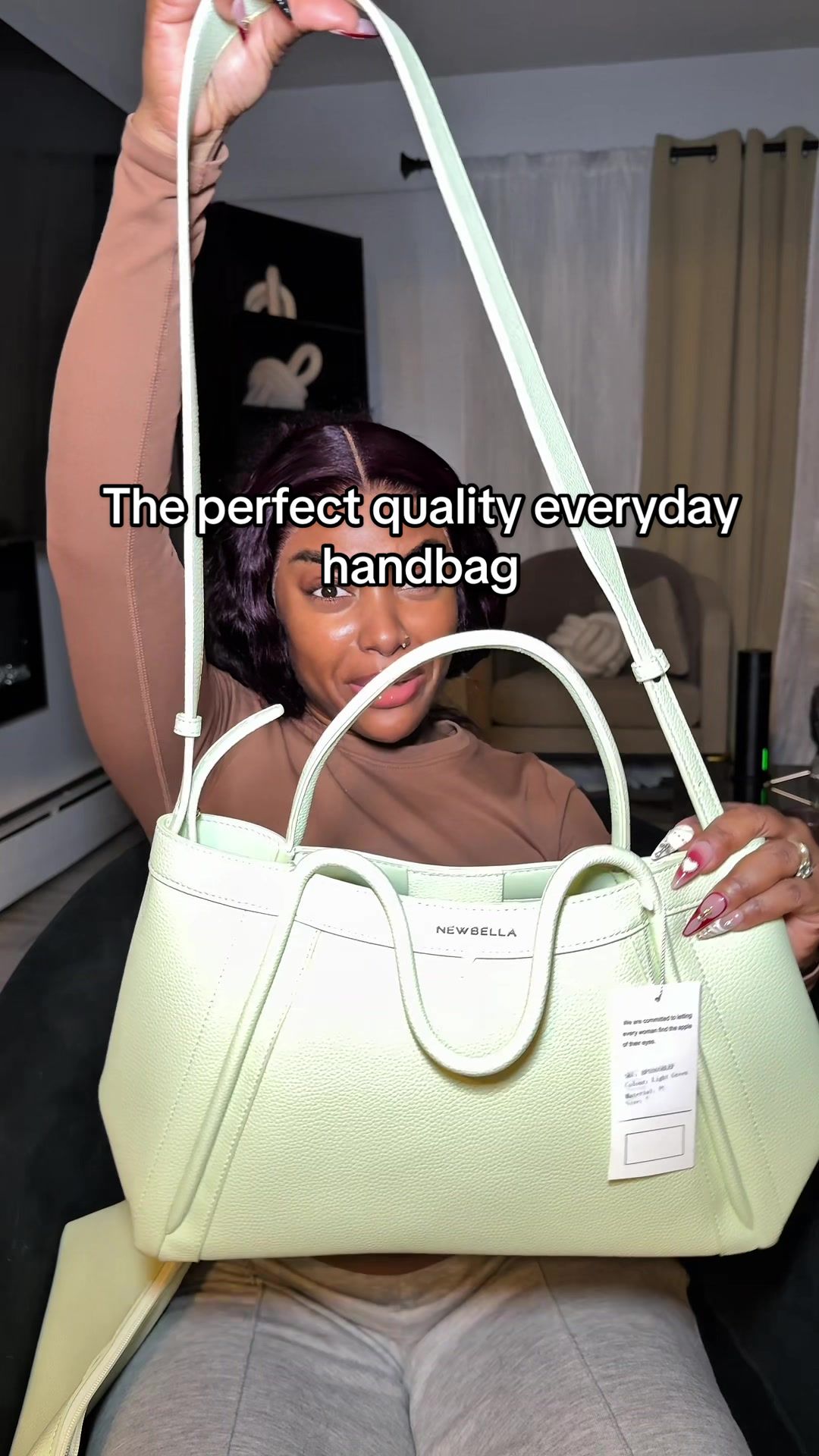 TikTok post by @petite3ssence for NEWBELLA. Caption reads: This handbag is so gorgeous @NEWBELLA....