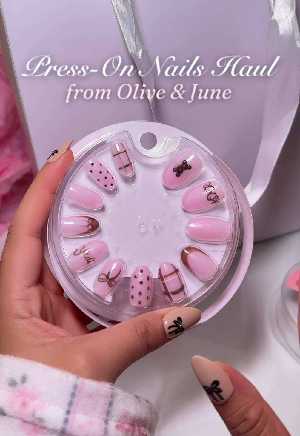 TikTok post by @asmrwithyadi for Olive & June. Caption reads: ASMR Press-On Nails Haul🧸🎀 Thank you SO much....