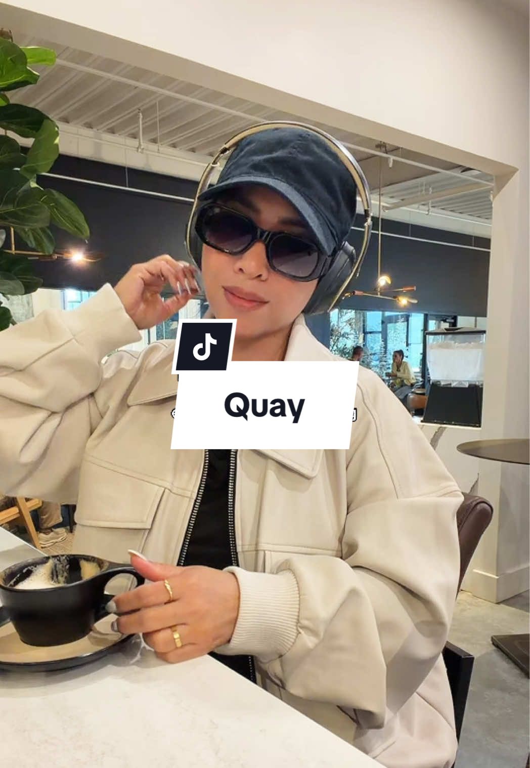 TikTok post by @trishugccreator for QUAY. Caption reads: @Quay Hyped up is the best everyday [...].