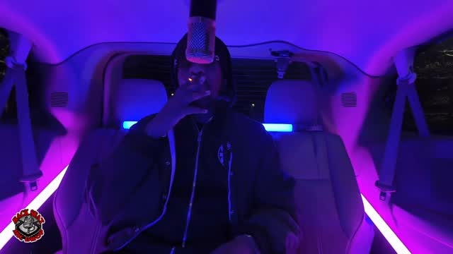 Instagram post by @iammoneymic for Genius. Caption reads: DMV ARTIST @iammoneymic jumped in the “BACK SEAT”....