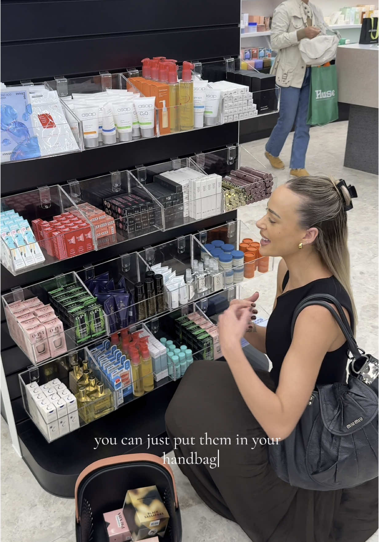 TikTok post by @emdavies___ for Adore Beauty. Caption reads: @Adore Beauty has a store IRL now guys 🥳🥳🥳 and....