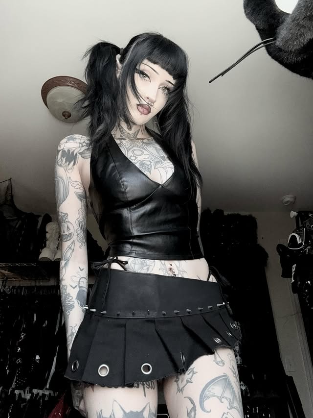 Instagram post by @horrorhailey for Dolls Kill. Caption reads: my new favorite skirt 🤍
-
top + skirt from....